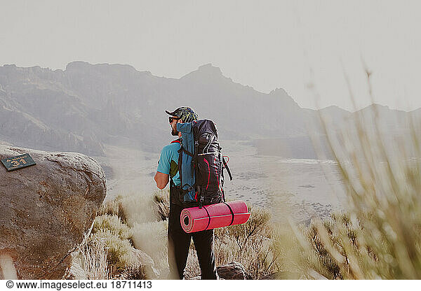 A hiker watching the landscape in Guajara Mountain in El Teide