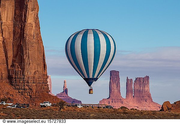 A hot air balloon flying in front of the Utah Monuments  Balloon Festival in the Monument Valley  Monument Valley Navajo Tribal Park  Arizona  USA  North America