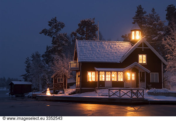 A house in the winter darkness  Sweden.