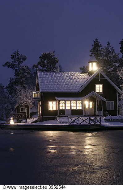 A house in the winter darkness  Sweden.