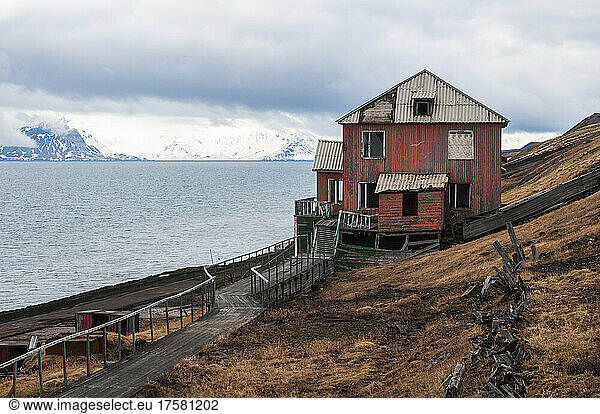 A house on the coast of the Russian settlement  Barentsburg. Barentsburg  Spitsbergen Island  Svalbard  Norway.