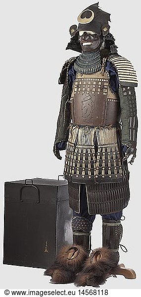 A Japanese suit of armour  middle to the end of the Edo period Assembled from old pieces. A hineno-kabuto with a five-lame hineno-shikoro and three leaf-shaped iron forehead reinforcements. Lacquer and binding badly damaged. Later iron Nara type mempo with remnants of glue. Lacquered saburini with a four-lame yodarekake in kebiki binding. Light iron plate go mai tatehagi do  lacquered saburini with a shairo coloured binding. There is a hachiman bonji on the breast plate. Seven five-lame  black lacquered kusazuri. Seven-lame black lacquered chu-sode  in kizuki-kozane with shairo coloured kebiki binding. Black lacquered mate gara haidate on dark blue linen. Black lacquered shino kote on dark green fabric. Shino-suneate of three broad  black lacquered shinos bound with kusari. A pair of later bearskin shoes. Height ca. 175 cm. It comes with a black-lacquered  recent armor case  historic  historical  19th century  18th century  Japanese  Asian  Asia  Far East  object  objects  stills  clipping  clippings  cut out  cut-out  cut-outs