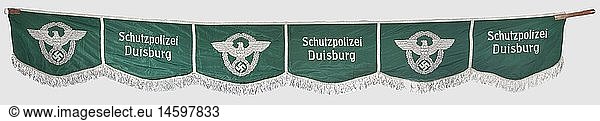A kettle drum banner  of Duisburg constabulary  circa 1938 Police-green silk cloth with six squares  the latter alternately embroidered with second model police eagle and handwritten 'Schutzpolizei Duisburg'. Encircling silver threads of aluminium web. Lined inside with green cloth  complete with all fastening loops. Length 220 cm. Embroideries hand-made in finest Leon quality. Only light usage marks  very good overall condition  historic  historical  1930s  20th century  object  objects  stills  clipping  clippings  cut out  cut-out  cut-outs  insignia  symbols  symbol  emblem  emblems  flag  flags  banner  banners