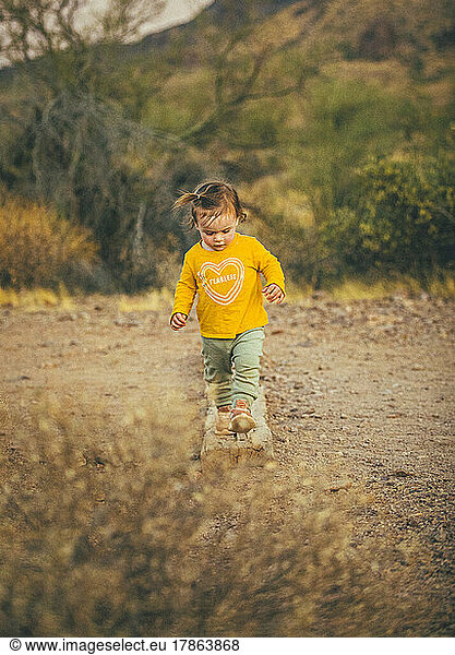 A kid is walking in Lost Dutchman State Park