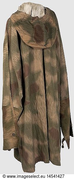 A lace-up shirt in 'Sumpftarn' (marsh) camouflage pattern  printed on one side  with hood  breast lacing and two lateral  vertical pockets. The left one stamped on the interior 'RB NR 0/1001/0219?'. All lacing and buttons present. In outstanding condition  historic  historical  1930s  20th century  army  armies  armed forces  military  militaria  object  objects  stills  clipping  clippings  cut out  cut-out  cut-outs  uniform  uniforms  piece of clothing  clothes  outfit  outfits  camouflage  camouflages  textile