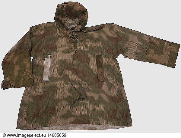A lace-up shirt in 'Sumpftarn' (marsh) camouflage pattern  printed on one side  with hood  breast lacing and two lateral  vertical pockets. The left one stamped on the interior 'RB NR 0/1001/0219?'. All lacing and buttons present. In outstanding condition  historic  historical  1930s  20th century  army  armies  armed forces  military  militaria  object  objects  stills  clipping  clippings  cut out  cut-out  cut-outs  uniform  uniforms  piece of clothing  clothes  outfit  outfits  camouflage  camouflages  textile