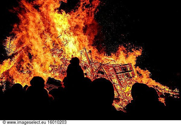 A large local crowd at the hogmanay bonfire  lit on 31st December each year to celebrate the new year in the Scottish town of Biggar.