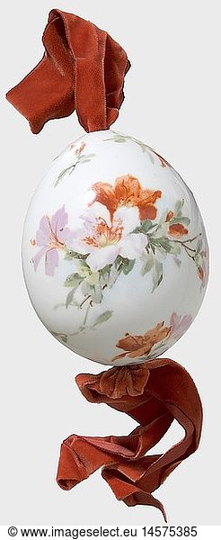 A large porcelain easter egg  Imperial Russian Porcelain Manufactory St. Petersburg  after 1900. White  glazed porcelain with coloured floral designs and the hand-painted Cyrillic inscription 'Christos Voskrese'. Height ca. 14 cm. Red velvet suspension. historic  historical  1900s  20th century  object  objects  stills  clipping  clippings  cut out  cut-out  cut-outs
