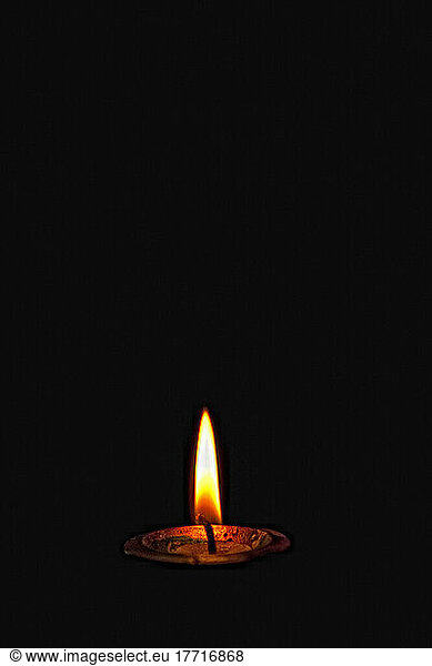 A Lit Candle In The Darkness