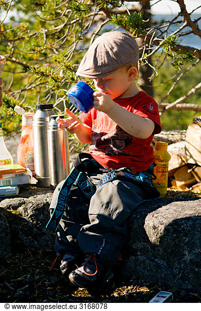 A little boy on a rock  Norway.