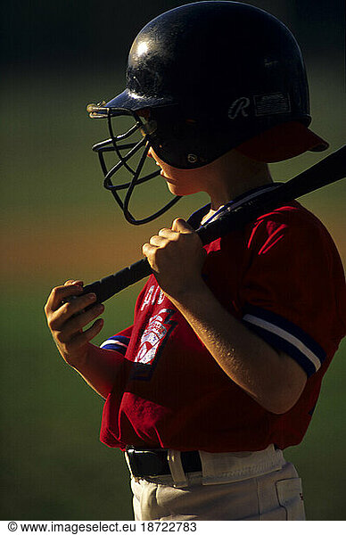 A little league player at the on-deck circle getting ready to bat  Houston  TX.