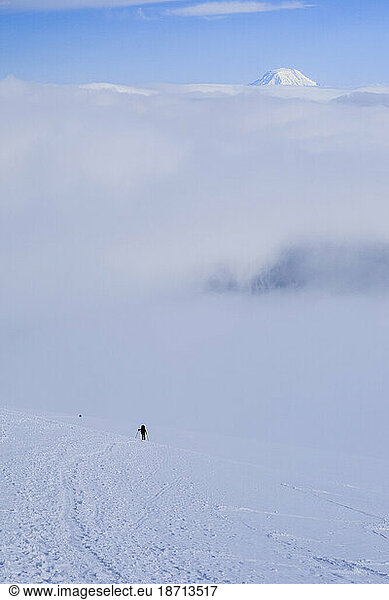 A Lone Climber Nears Mount Rainier's Camp Muir With Mt Adams Behind