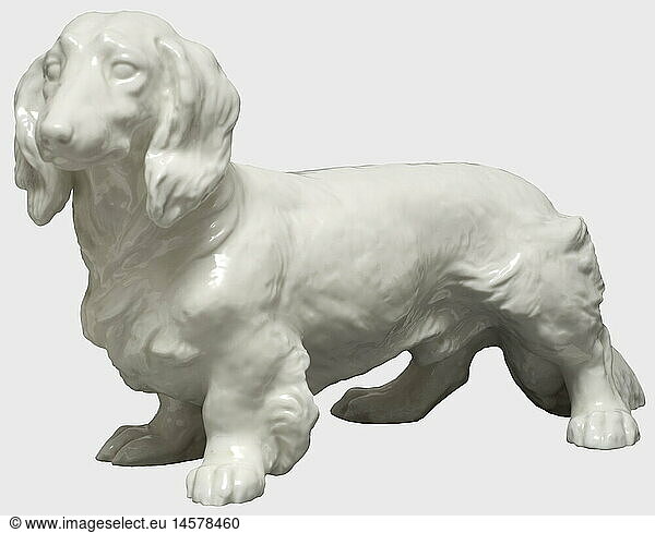 A longhaired dachshund  Allach Porcelain Factory Design by Ottmar Obermaier. Model Number '75'. Model number  and manufacturer's mark in underglaze green on the belly. Height 19 cm. Small chip on the right front paw.  historic  historical  1930s  1930s  20th century  object  objects  stills  clipping  clippings  cut out  cut-out  cut-outs
