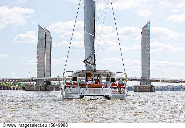 A luxurious catamaran cruising on the Garonne river  Bordeaux  Gironde  France.
