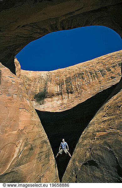 A man below an arch  Moab  Utah.