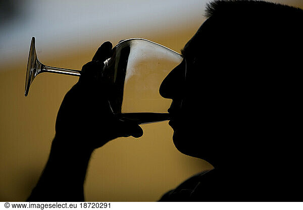 A man drinks a glass of red wine in the Taramilla winery in Prado del Rey  Cadiz province  Andalusia  Spain.