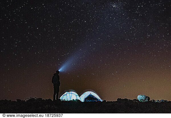 A man in the base camp under the stars