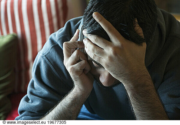 A man listening to his cell phone.