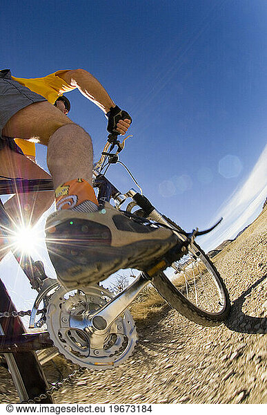 A man mountain bikes at Horsetooth Reservoir  Fort Collins  Colorado.