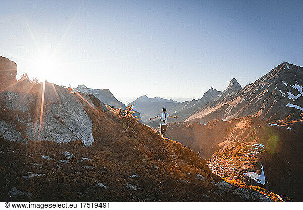 A man with a camera is standing in North Cascades near mt. Baker
