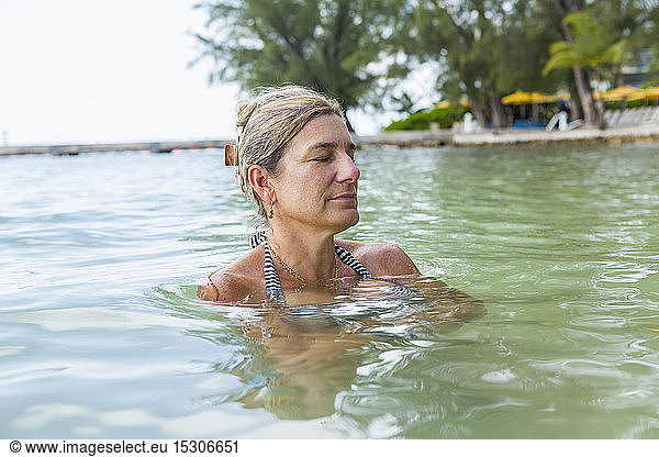 A mature woman relaxing in ocean water
