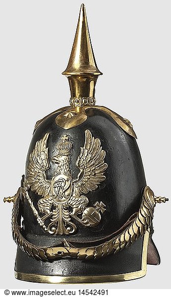 A model 1842 helmet for officers  of infantry regiments 1 -12. Black lacquered leather skull  gilded mountings  simple cross spike base. Eagle plate exchanged  double holes  the separately attached 1860 fatherland scroll removed. Convex metal chinscales on long screws. Leather cockade. Green and red covered peaks. Leather lining  historic  historical  19th century  Prussian  Prussia  German  Germany  militaria  military  object  objects  stills  clipping  clippings  cut out  cut-out  cut-outs  helmet  helmets  headpiece  headpieces  utensil  piece of equipment  utensils  protection  headgear  headgears  uniform  uniforms