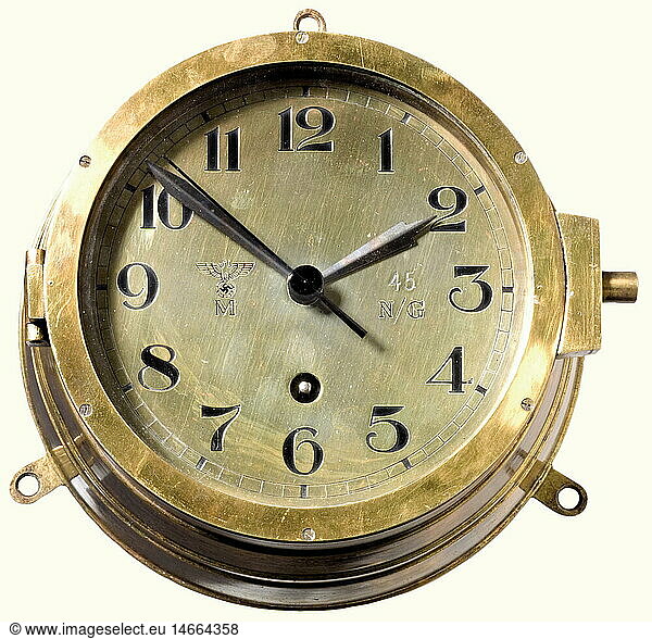 A naval ship's bulkhead clock  made by Kieninger & Obergfell. Brass housing and dial with blued hands. An imperial eagle  'M'  and the navy number '45' stamped above 'N/G'. The lid is marked '68'  the reverse side with three suspension loops and mark '3668'. Diameter 17 cm (front) or 20 cm (back)  respectcively . Complete wih both keys. Fully functional. historic  historical  1930s  1930s  20th century  navy  naval forces  military  militaria  branch of service  branches of service  armed forces  armed service  object  objects  stills  clipping  clippings  cut out  cut-out  cut-outs  clock  clocks  watch  watches  timepiece