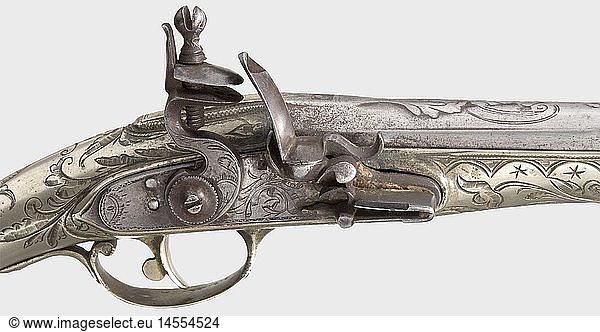 A nickel-silver mounted Balkan/Turkish flintlock pistol  19th century Round  smooth bore barrel in 15 mm calibre stamped with head-shaped marks and cut with floral designs on the breech. Engraved iron flintlock. Decoratively carved stock. Nickel-silver trigger guard  lavishly chiselled with ornamental designs. Length 41 cm. historic  historical  19th century  Ottoman Empire  handgun  handheld  firearm  fire arm  gun  fire arms  firearms  guns  weapon  arms  weapons  arms  pistols  object  objects  stills  clipping  clippings  cut out  cut-out  cut-outs
