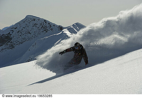 A 'noboarder' riding without bindings.