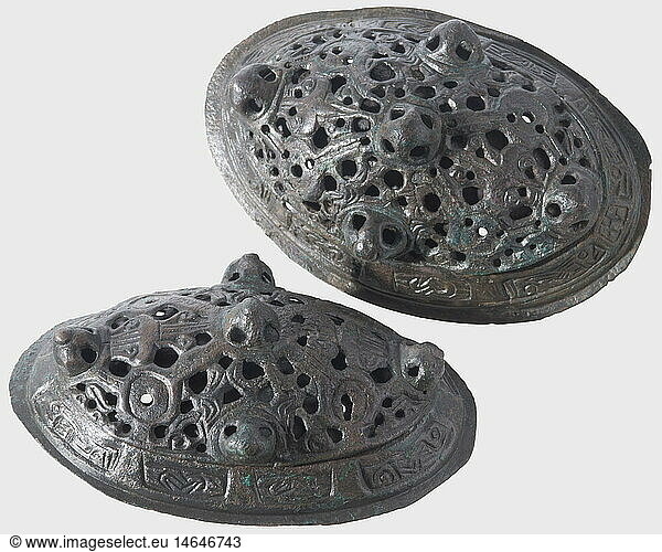 A pair of Viking tortoise fibulae  Scandinavia  9th century. Bronze with greenish patina. Two-layers  oval convex shape. The upper layer with openwork ornamental decoration and five adorning bosses. Finely engraved border with animal portrayals and imitating braidwork. The interiors retaining the pin attachment  the pins themselves are missing. Cleaned archaeological discovery. Length of each 10.5 cm. historic  historical  ancient world  ancient world  ancient times  object  objects  stills  clipping  cut out  cut-out  cut-outs