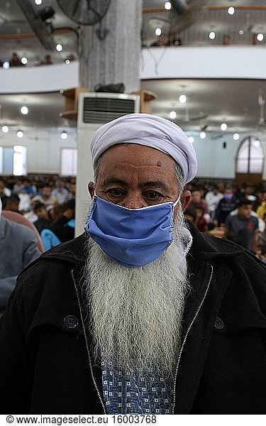 A Palestinian Muslim listens to Imam while wearing a face mask as a precaution against COVID-19  during Eid Al-Fitr Festival following the reopening of mosques by local authorities and relaxation of some restrictions. Eid Al-Fitr marks the end of the holy fasting month of Ramadan  May 24  2020.