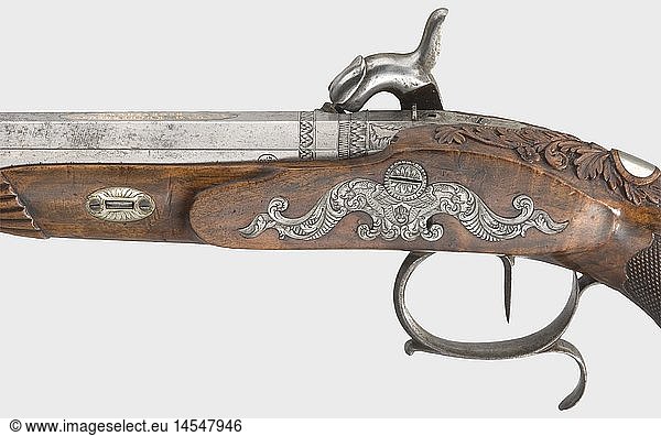 A percussion pistol  Johann Adam Kuchenreuter in Regensburg  circa 1830/40. Octagonal barrel with an eight-groove rifled bore in 12.5 mm calibre  the signature  'J. Adam Kuchenreuter Ã  Regensburg' inlaid in gold on top of the barrel  and finely engraved decorative scrolls on the barrel root. Stamped 'ELG' on the side. The adjustable rear sight mounted on the tang  which is engraved with the number '2'. Percussion lock with an engraved lock plate and a pivoting nipple protector. Double set trigger. Finely carved  walnut root wood  half stock. Finely engraved iron furniture. Blank silver escutcheon. Length 36 cm. Johann Adam Kuchenreuter (1794 - 1869) was court gunsmith to the Princes of Thurn and Taxis  and royal Bavarian court gunsmith from 1840. historic  historical  19th century  18th century  civil handgun  civil handguns  handheld  gun  guns  firearm  fire arm  firearms  fire arms  weapons  arms  weapon  arm  object  objects  stills  clipping  clippings  cut out  cut-out  cut-outs