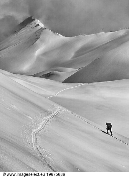 A person ski touring in the French Alps.