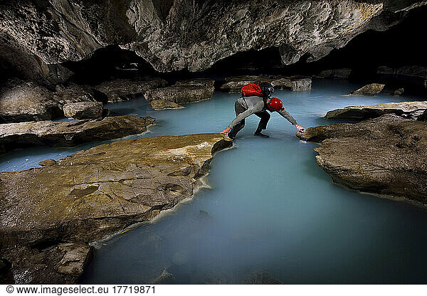 A photo assistant crosses sulphurous water in Cueva de Villa Luz in Tabasco  Mexico.