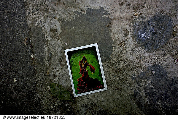A picture of a Flamenco dancer lays in the street in Granada  Andalusia  Spain.