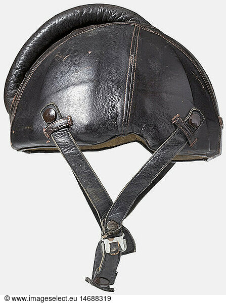 A pilot's flight protection helmet  model SSK 90 Body of riveted steel plates with cover and bulge of brown leather (flawed). Lining of sand coloured mottled cotton with maker's label 'Siemens - Baumuster SSK90 - Hersteller Luftfahrtgerätewerk Hakenfelde GMBH - STRIWA - Kopfgröße 57-59'. Strapping with button fastening. Also included is a Luftwaffe summer flight helmet model LKp S 101 constructed of sand coloured cotton with brown leather trim. Three-point attachment for the oxygen mask  complete with cable and throat microphone. Some soiling and repairs. historic  historical  1930s  1930s  20th century  Air Force  branch of service  branches of service  armed service  armed services  military  militaria  air forces  object  objects  stills  clipping  clippings  cut out  cut-out  cut-outs  uniform  uniforms  headpiece  headpieces