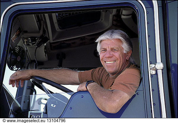 A portrait of a friendly Caucasian male truck driver.