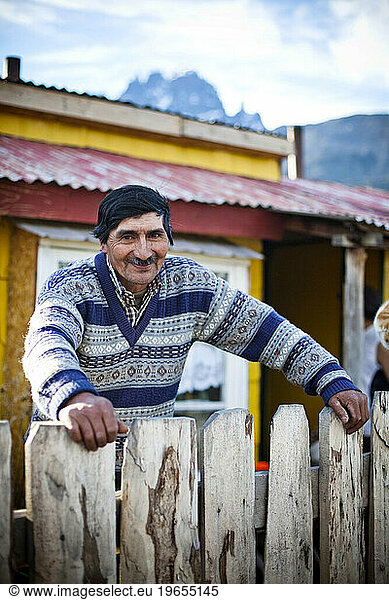 A portrait of a man smiling at the camera.