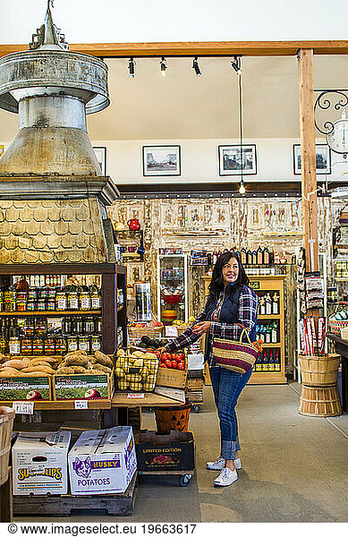 A portrait of a woman shopping in a small business in Enumclaw  Washington  USA.