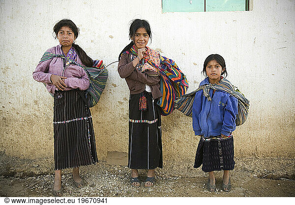 A portrait of three girls in rural Guatemala.