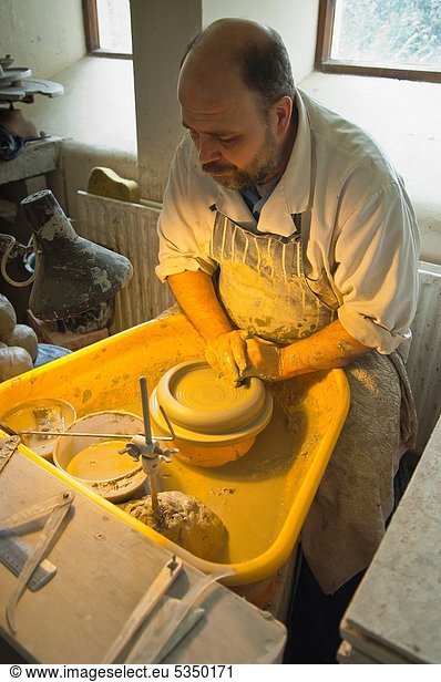 A potter at work in the Wensleydale Pottery in Hawes in Wensleydale in North Yorkshire   England   Britain   Uk