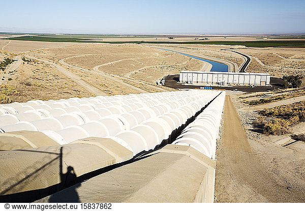 A pumping station on the California aquaduct that brings water from snowmelt in the Sierra Nevada mountains to farmland in the Central Valley. Following a four year long catastrophic drought
