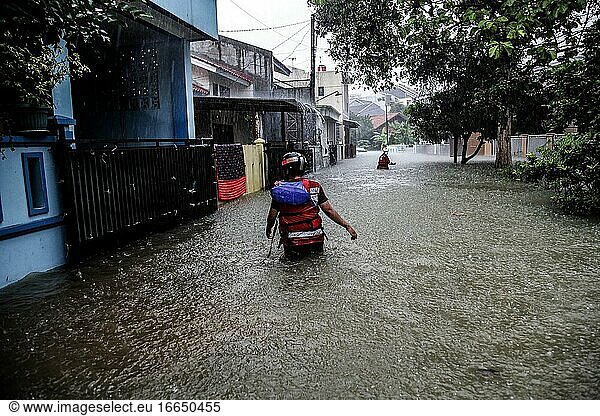 A rescue team seen walking among from flooded houses in Bogor  West Java  October 25  2020.