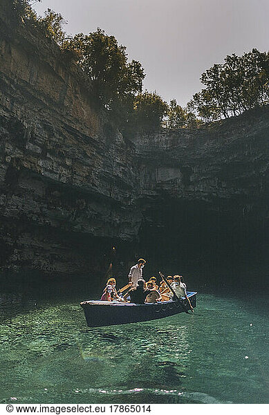 A rowing tourist boat against Melissani lake-cave  Kefalonia  Greece