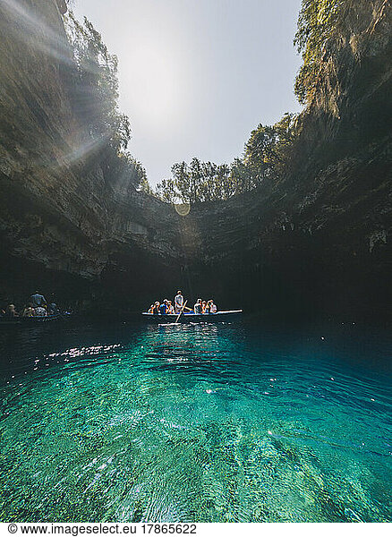 A rowing tourist boat against Melissani lake-cave  Kefalonia  Greece