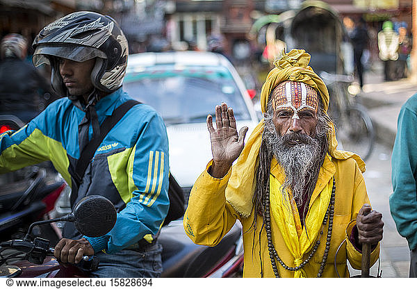 A sadhu  a Hindu holy man  pauses on a street in Kathmandu  Nepal