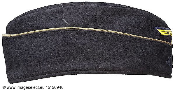 A 'Schiffchen' on-board cap for officers of the Kriegsmarine Depot piece of navy-blue woollen cloth  continuous golden officer's braid  black inner liner  BeVo weave insignia on a dark blue ground. Light signs of usage. historic  historical  navy  naval forces  military  militaria  branch of service  branches of service  armed forces  armed service  object  objects  stills  clipping  clippings  cut out  cut-out  cut-outs  20th century