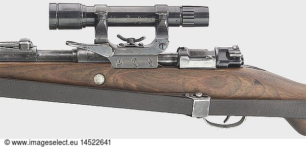 A scope rifle 98 k  code 'dou 42'  with short side mount and 'SS-Dienstglas'/service scope  8 x 57 cal.  no. 1805. Matching numbers. Mirror-like bore. Produced by Waffenwerke BrÃ¼nn AG  Bystrica. Various acceptance marks eagle/'WaA80'. Finish partially thin and spotted. Laminated stock complete with strap and cleaning rod. Mounted front sight guard. Good to very good overall condition. Mounted: a not clearly identified scope without code or manufacturer (Opticotechna Prerau?)  length without protection tubes 165 mm  barrel diameter 45 mm. Possibly forerunner or successor of ZF 41(?). Reticule s historic  historical  1930s  20th century  ordnance weapon  service weapon  weapons  arms  weapon  arm  militaria  German  Germany  firearm  fire arm  gun  fire arms  firearms  guns  object  objects  stills  clipping  clippings  cut out  cut-out  cut-outs