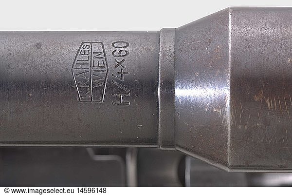 A scope rifle 98 k  code '237 - 1939'  with short side mount and scope ZF Kahles  8 x 57 cal.  no. 2242c. Matching numbers including screws. Mirror-like bore. Produced by Berlin-LÃ¼becker Maschinenfabrik  LÃ¼beck. Various acceptance marks eagle/'214'. Thin  spotted finish on all parts. Dark laminated stock complete with strap and cleaning rod. Good overall condition. Mounted: Scope 'K. Kahles Wien / H 4x60 / 40642'  reticule 1  lens shade  range setting scaled 1 - 8. On left side of barrel between the two rings a soldered and screwed down piece of steel to stop scope from moving on its own (forerunner to 'blow-back ring'). Scope technically and optically in good order. Spotted bluing. Mount with sixfold screwed-on rib without inscription or number. Spotted finish. Scope and mount in very good overall condition. Length 110 cm. Erwerbsscheinpflichtig. historic  historical  1930s  20th century  ordnance weapon  service weapon  weapons  arms  weapon  arm  militaria  German  Germany  firearm  fire arm  gun  fire arms  firearms  guns  object  objects  stills  clipping  clippings  cut out  cut-out  cut-outs