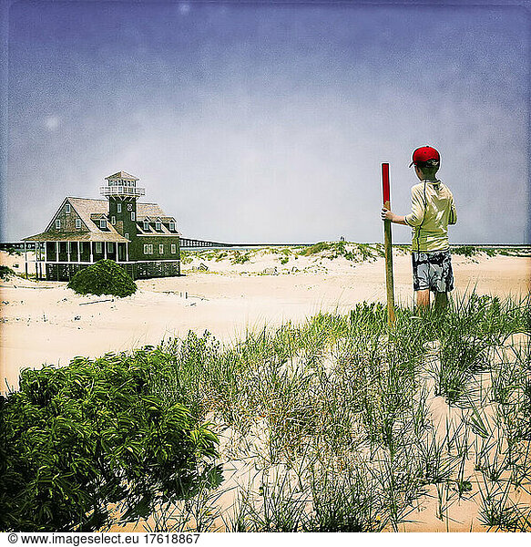 A seven year old boy checks out the old Coast Guard station.; Oregon Inlet  North Carolina.